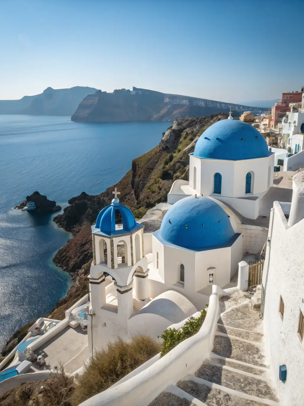 A stunning photograph of Santorini, Greece, showcasing the iconic white buildings and blue domes overlooking the Aegean Sea at sunset, capturing the essence of a luxurious and romantic getaway.